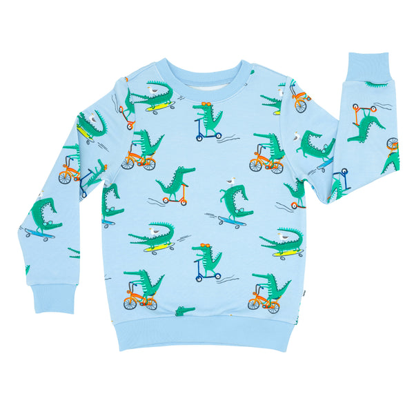 Flat lay image of a Later Gator crewneck sweatshirt