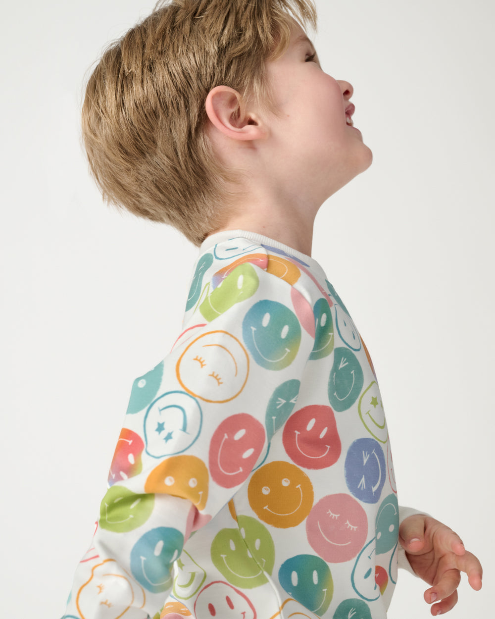 Close up of boy wearing the Positive Vibes Crewneck Sweatshirt