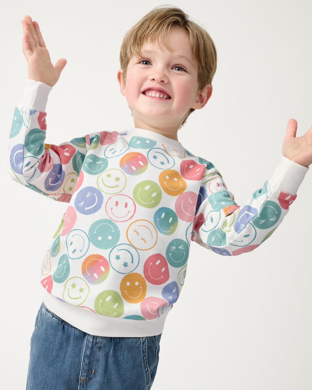 Clapping boy wearing the Positive Vibes Crewneck Sweatshirt