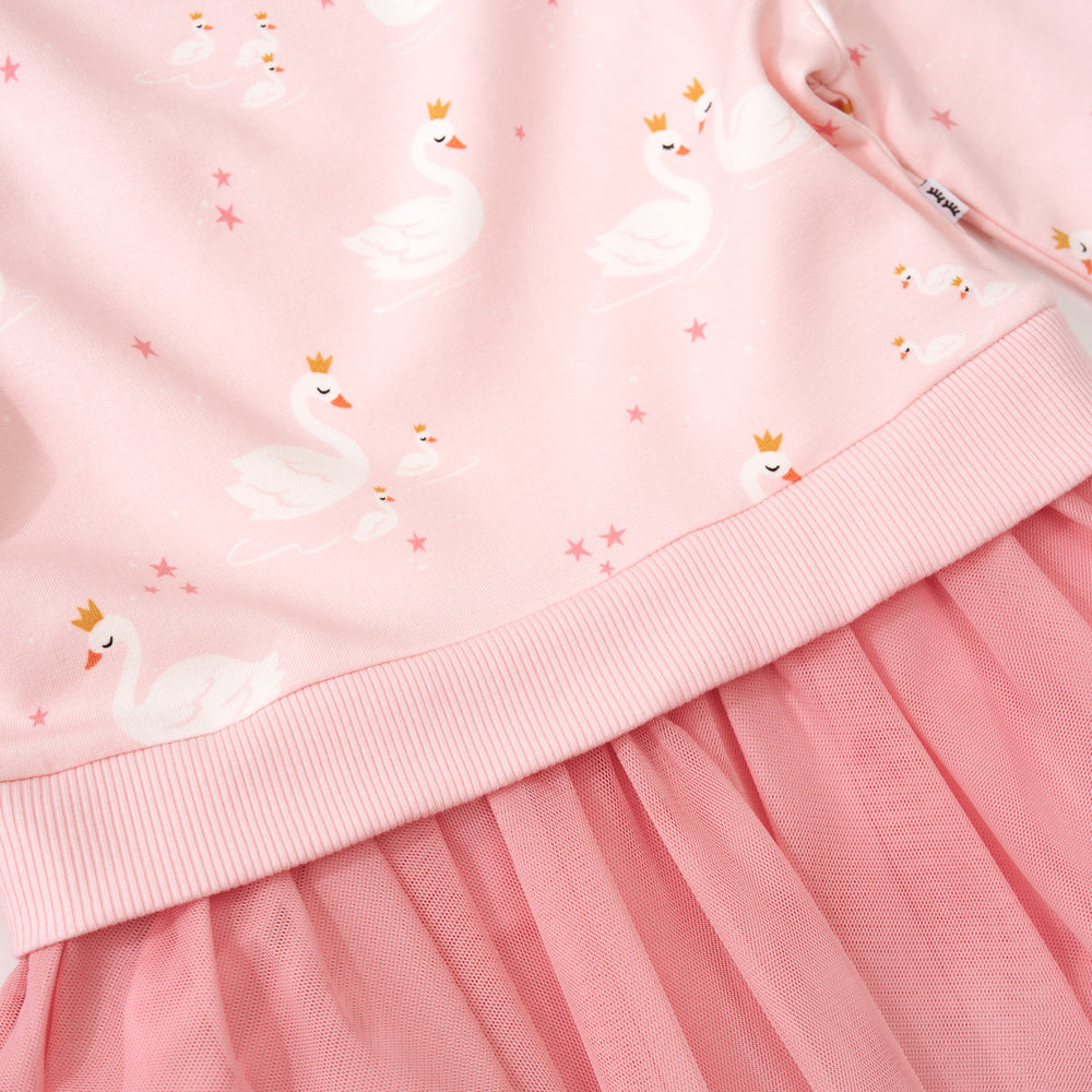 Close up image of the print and waistband on a Rosy Swan Crewneck Tutu Dress