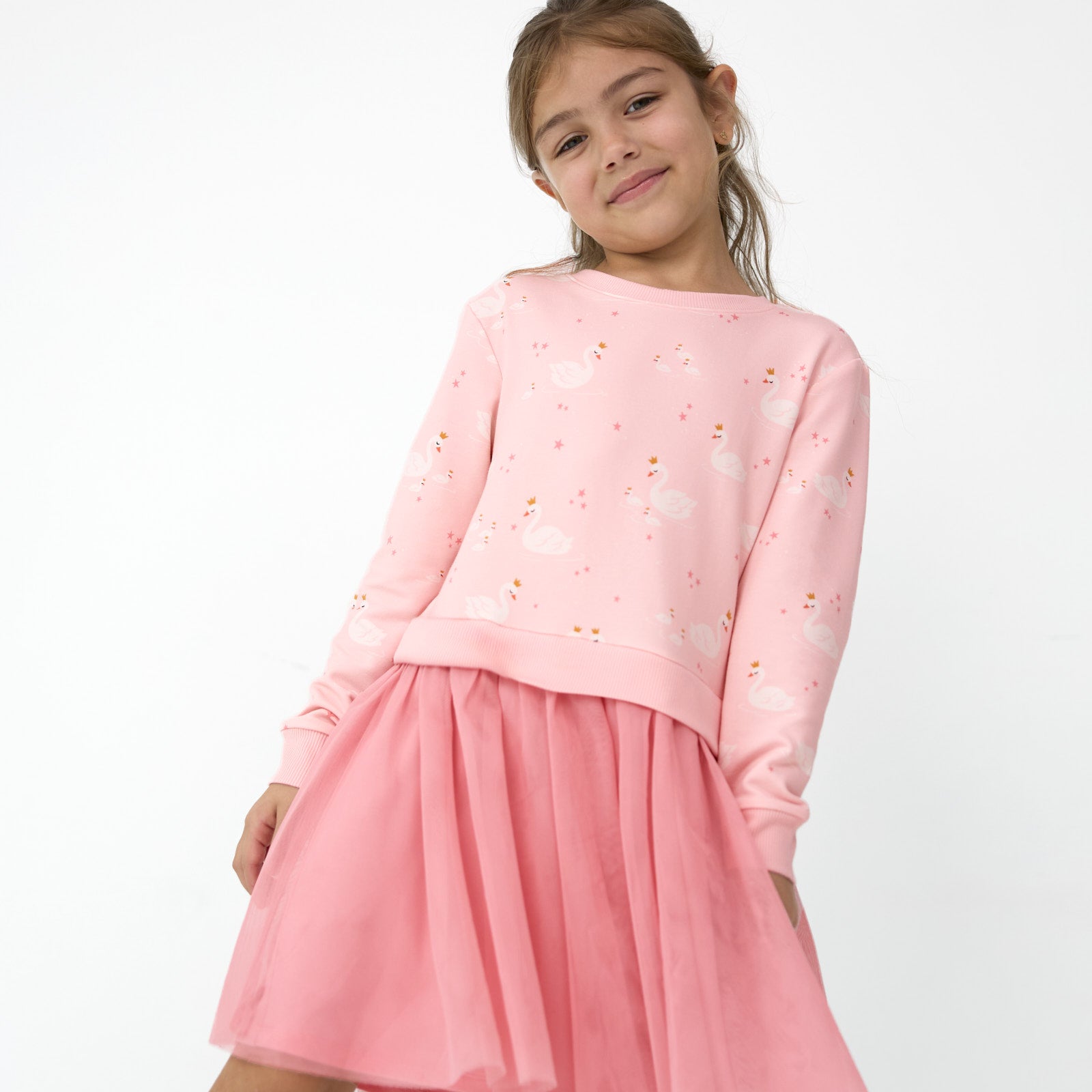 Girl posing in the Rosy Swan Crewneck Tutu Dress