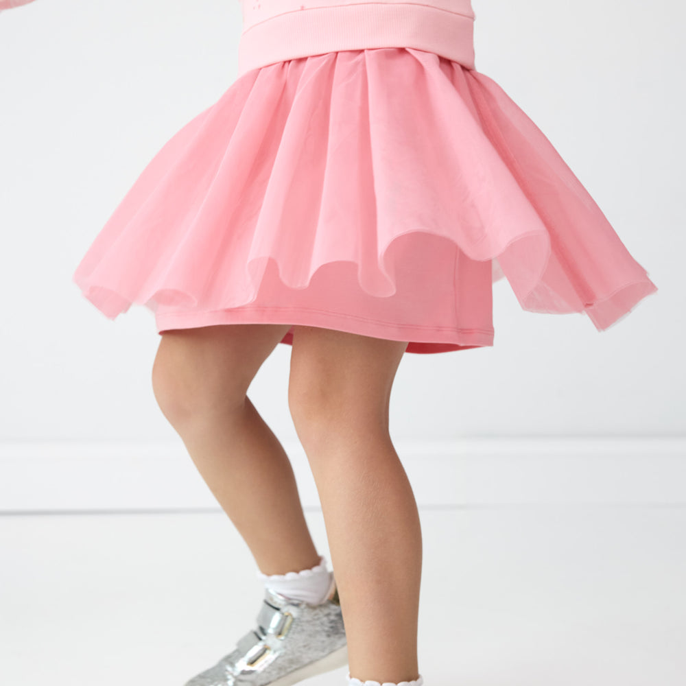 Close up image of the tutu detail on the Rosy Swan Crewneck Tutu Dress