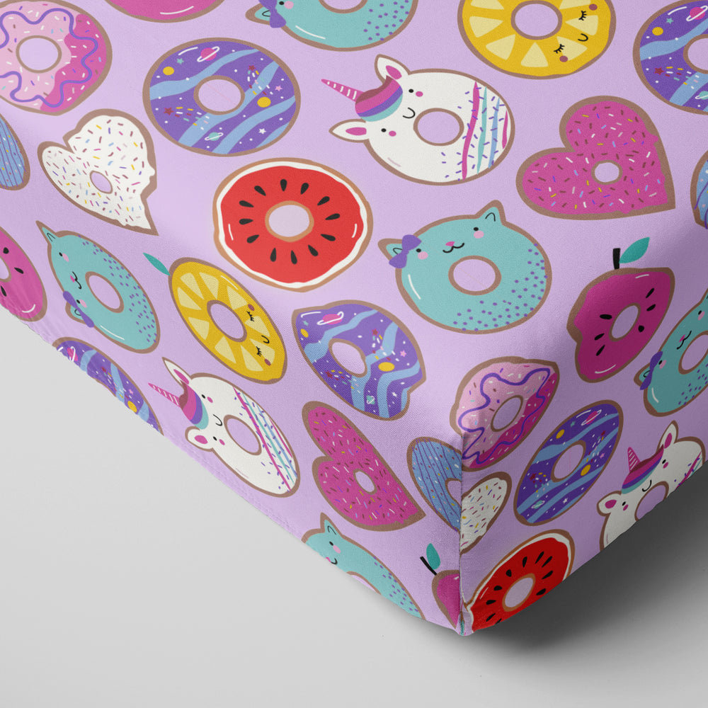 Click to see full screen - Corner view of Lavender Donut Dreams fitted crib sheet