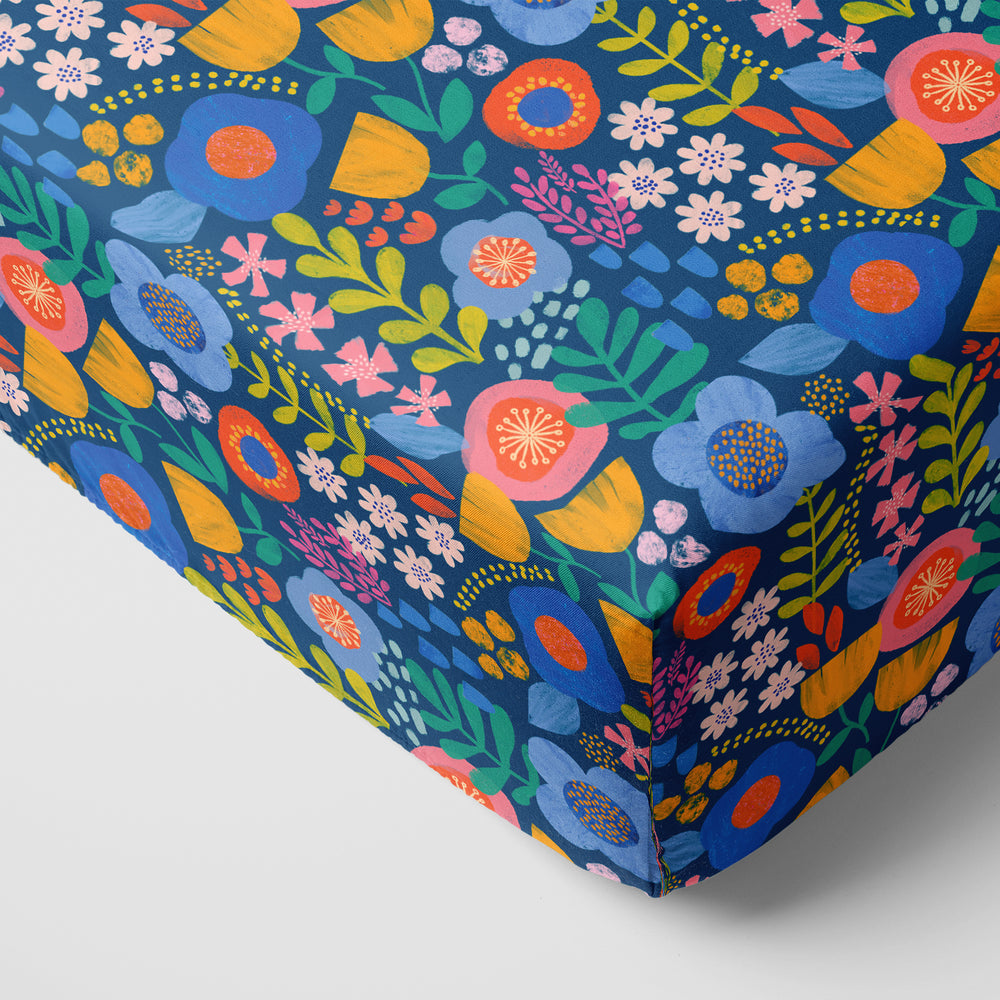 Corner image of the Folk Floral Fitted Crib Sheet