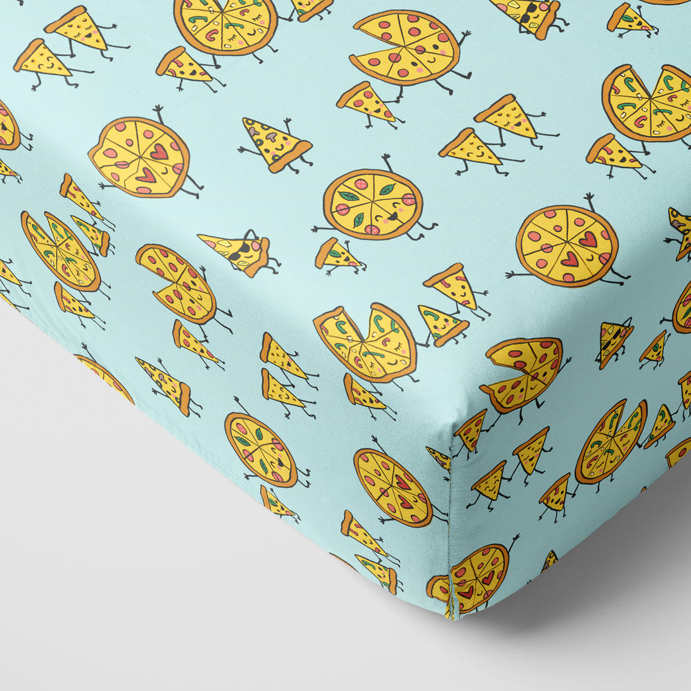 Corner view of a Pizza Pals fitted crib sheet