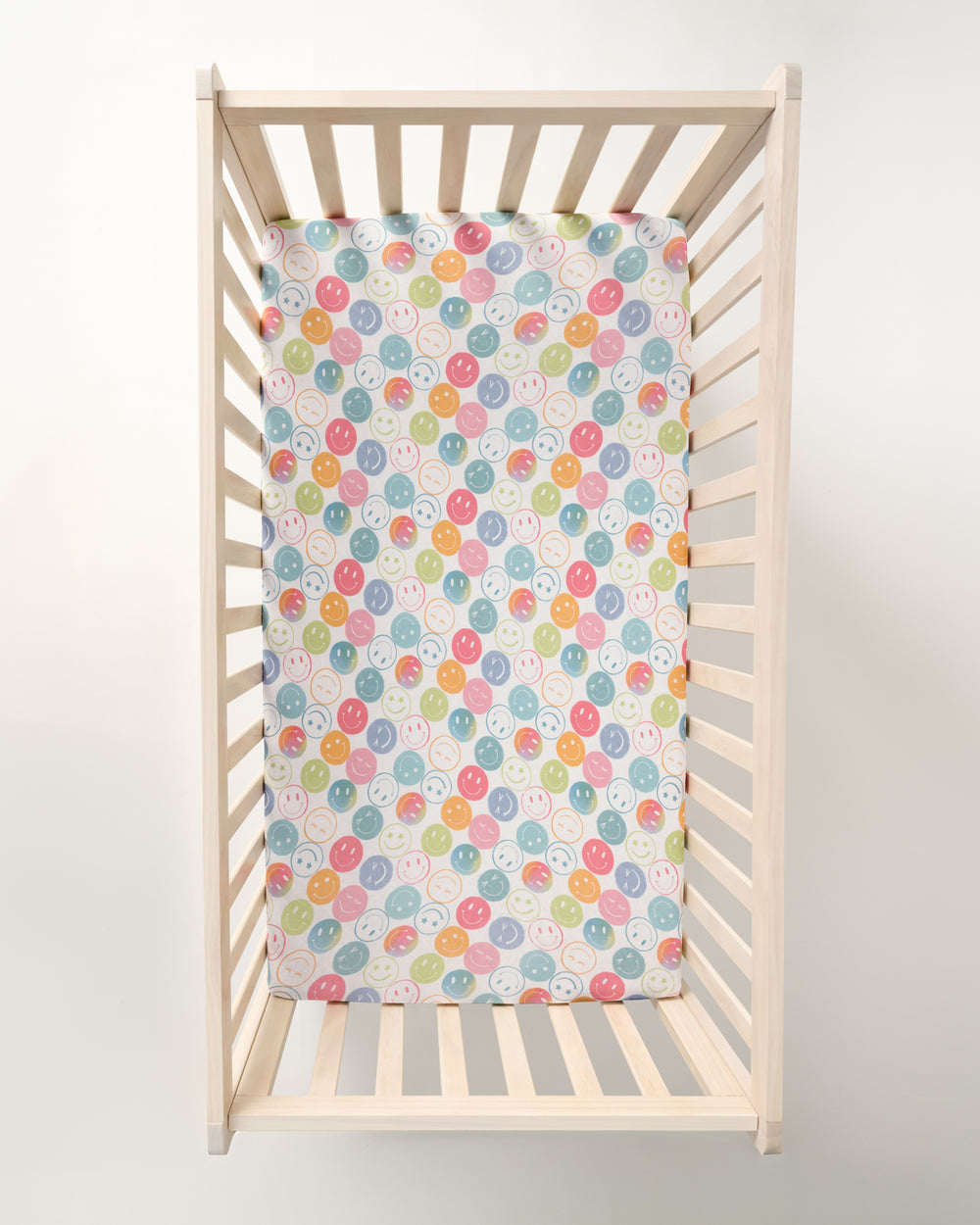 Overhead view of the Positive Vibes Fitted Crib Sheet