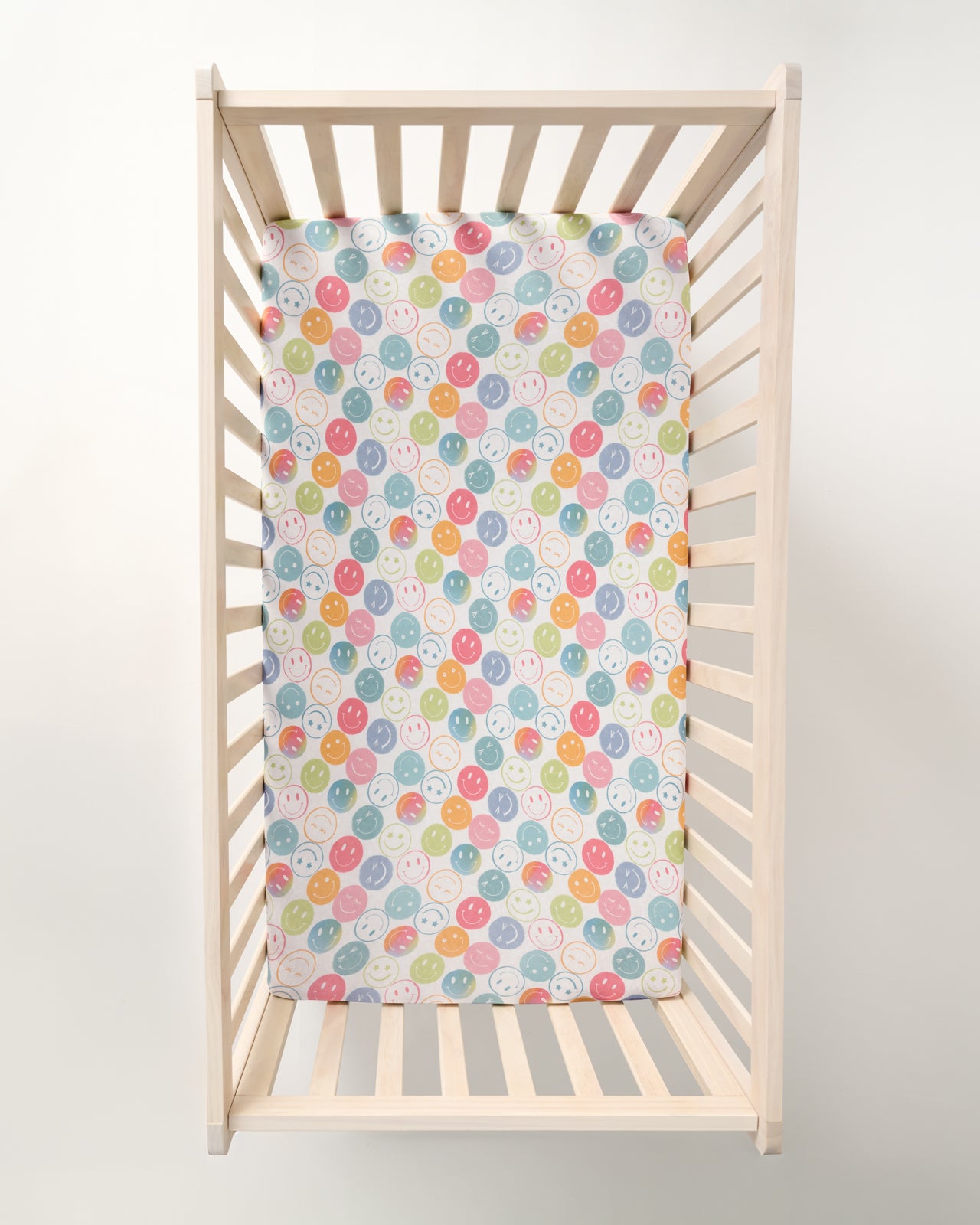 Overhead view of the Positive Vibes Fitted Crib Sheet