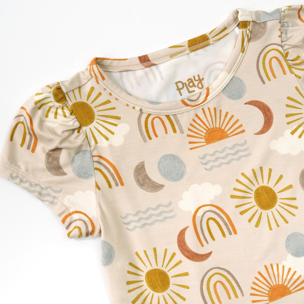 Close up detail shot of a Desert Sunrise Puff Sleeve Tee