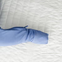 Close up image of a Slate Blue crescent zippy folded foot cuff