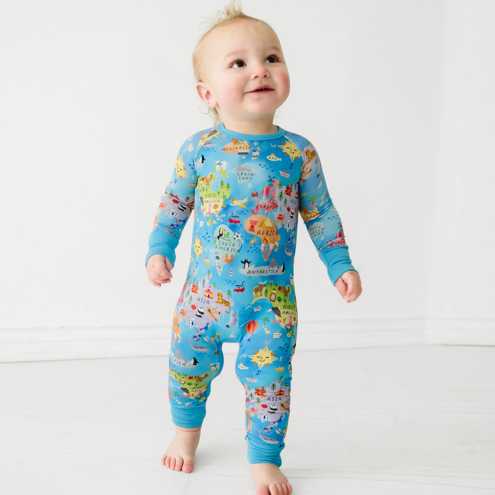 Child wearing an Around the World crescent zippy