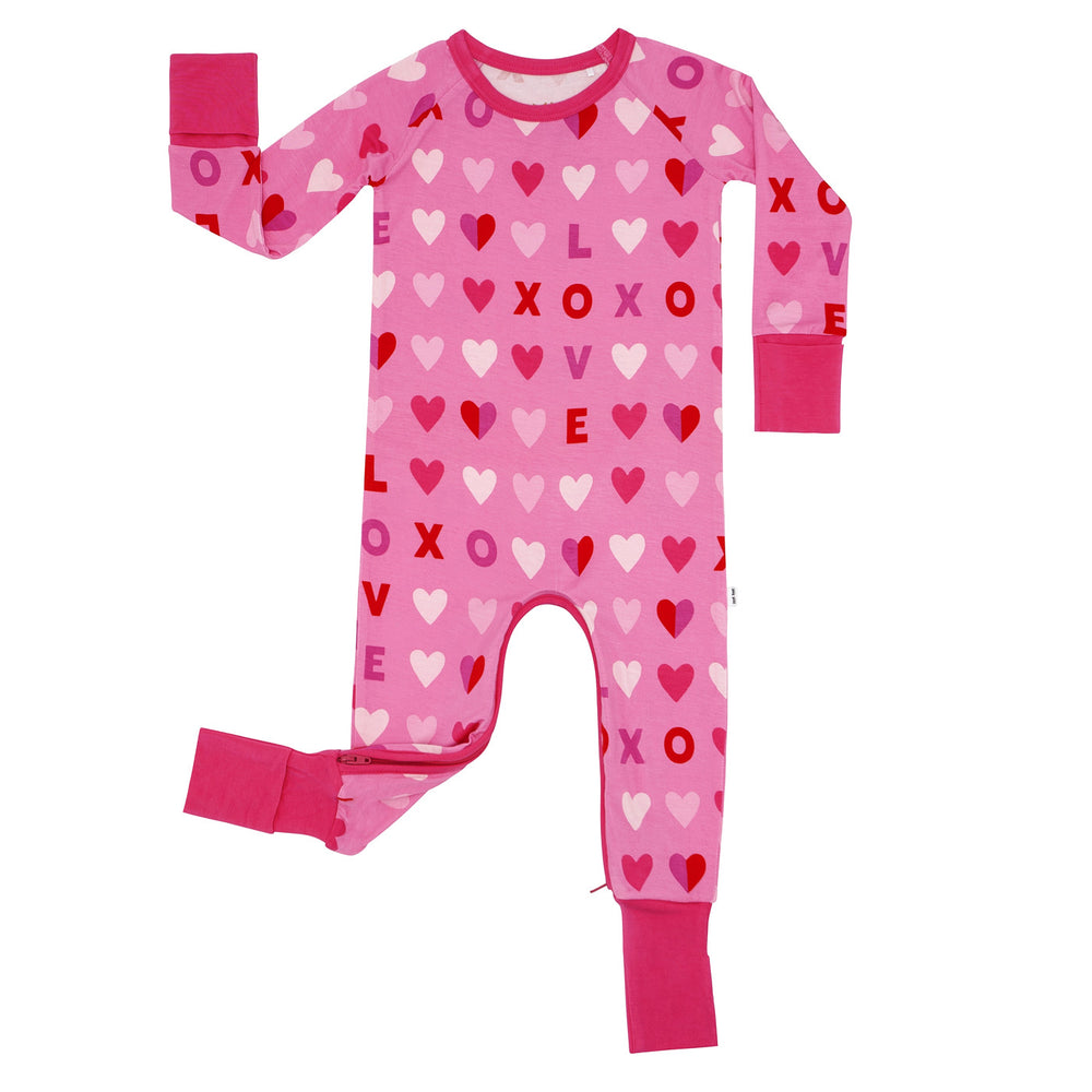 Click to see full screen - Flat lay image of a Pink XOXO crescent zippy