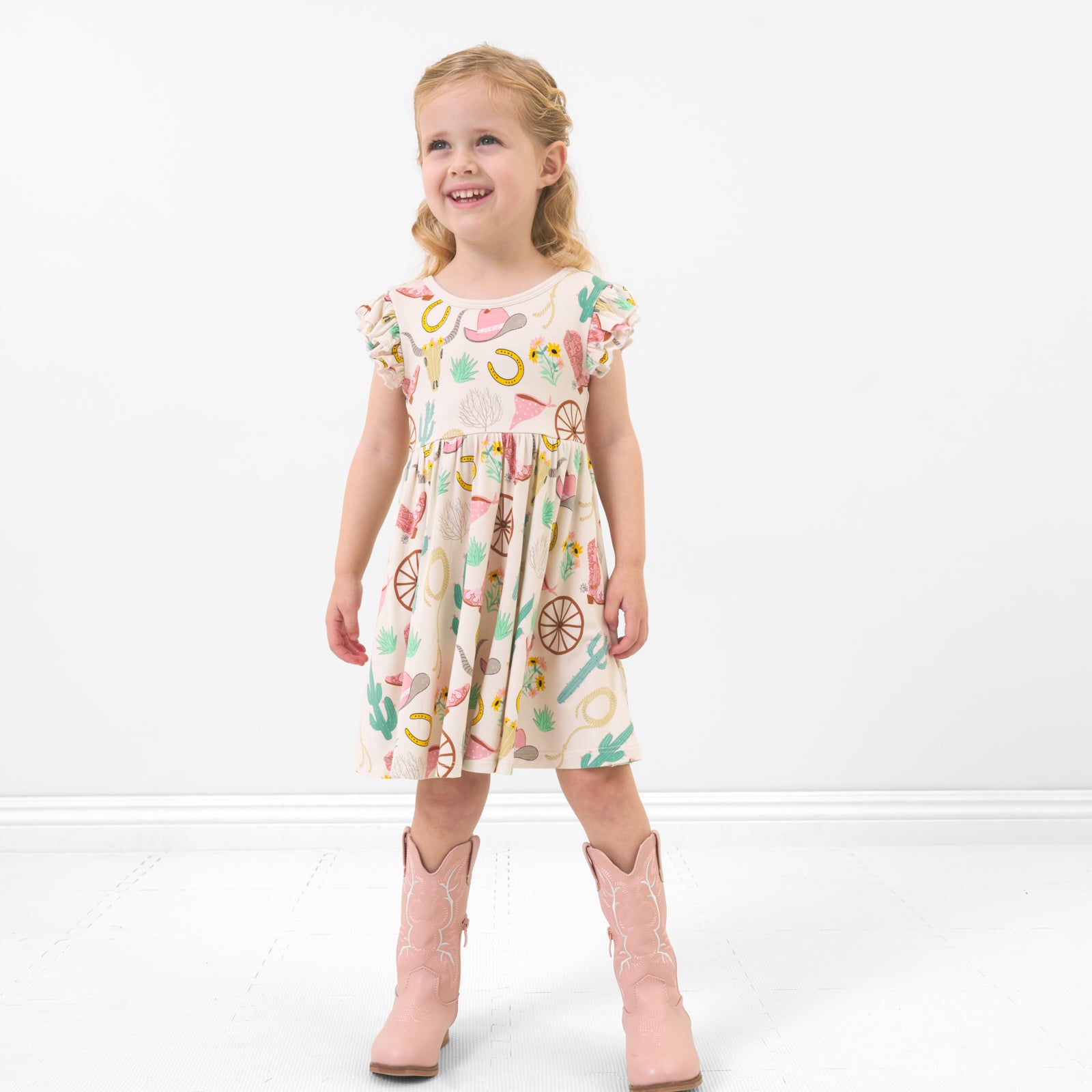 Alternate image of a child posing wearing a Pink Ready to Rodeo twirl dress