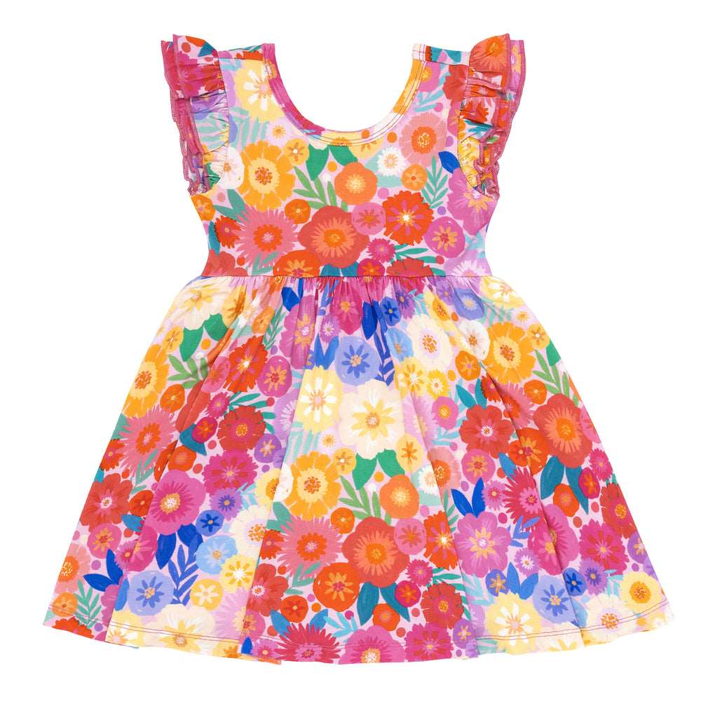 Flat lay image of a Rainbow Blooms flutter twirl dress