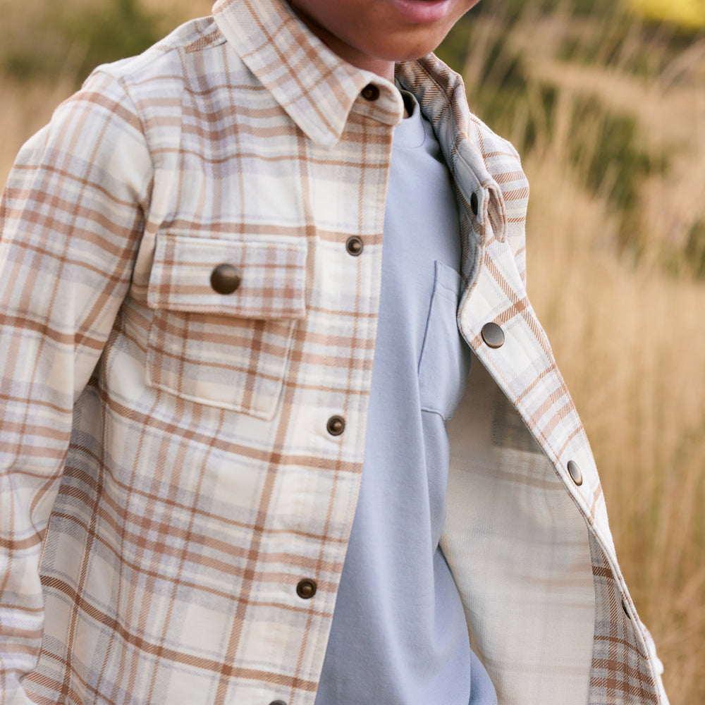 Close up image of boy wearing the Canyon Plaid Shacket