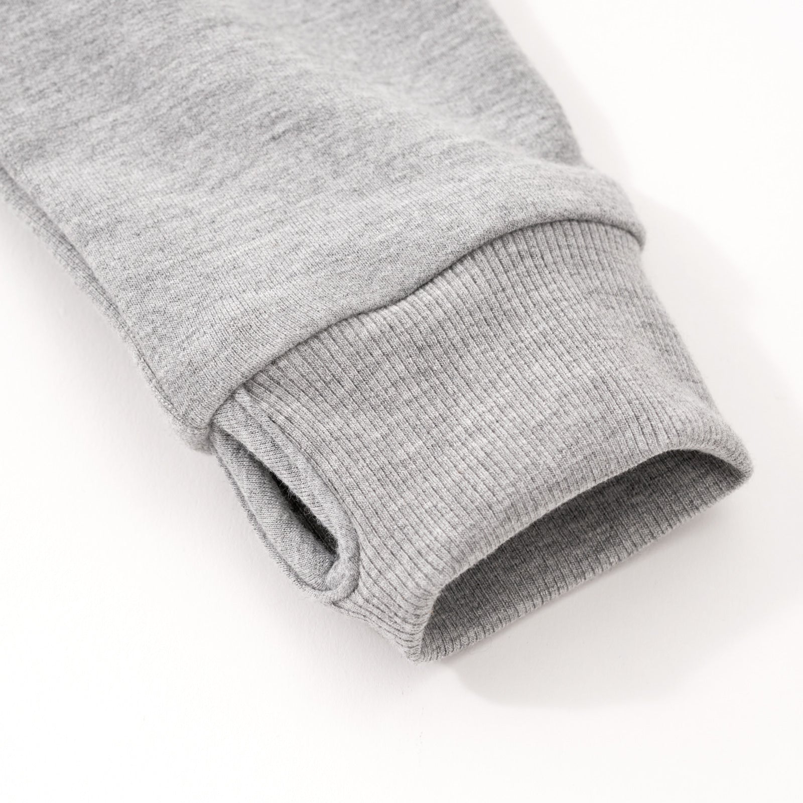 Close up image of the thumb hole detail on the sleeve of the Midwash Blue/Gray Denim Jacket