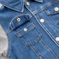 Close up image of the collar, upper buttons and pocket details on the Midwash Blue/Gray Denim Jacket