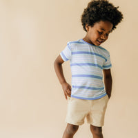 Child wearing Bone Drawstring Shorts with a Surf Stripes tee