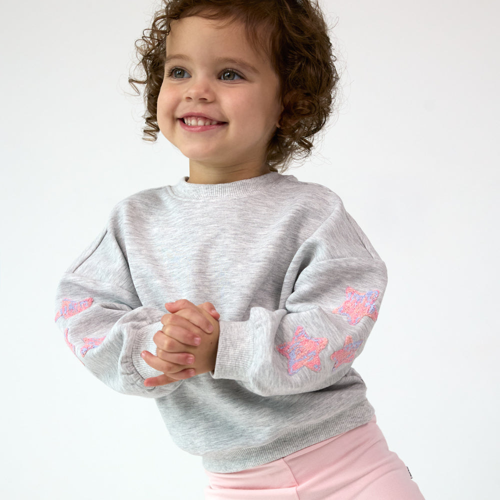 Smiling girl wearing the Light Heather Gray Drop Shoulder Crewneck