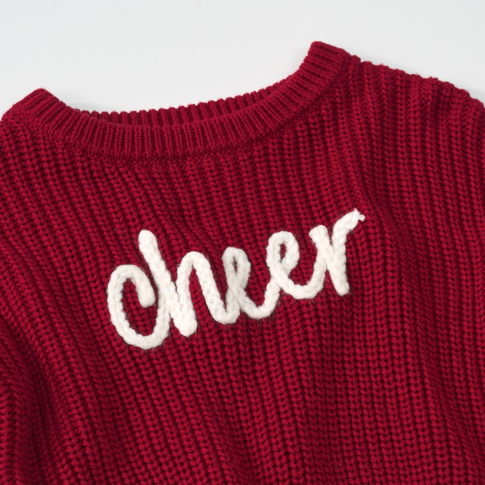 Close up detail shot of a Deep Crimson "Cheer" Drop Shoulder Sweatshirt