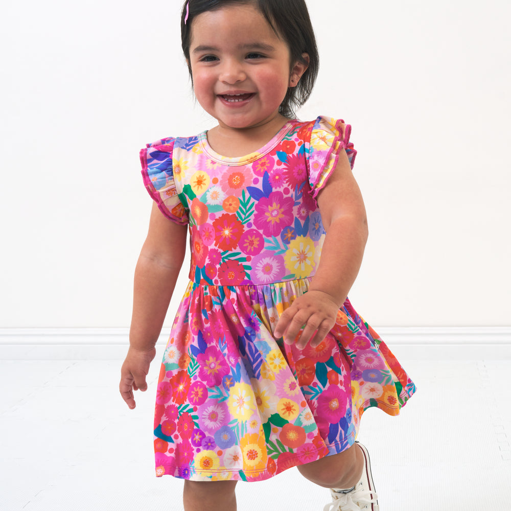 Alternate image of a child wearing a Rainbow Blooms flutter twirl dress with bodysuit