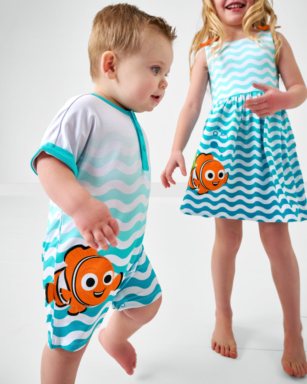 Two children wearing matching Nemo Graphics Play styles