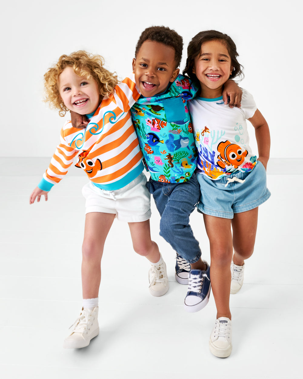 Three children wearing Finding Nemo Play styles