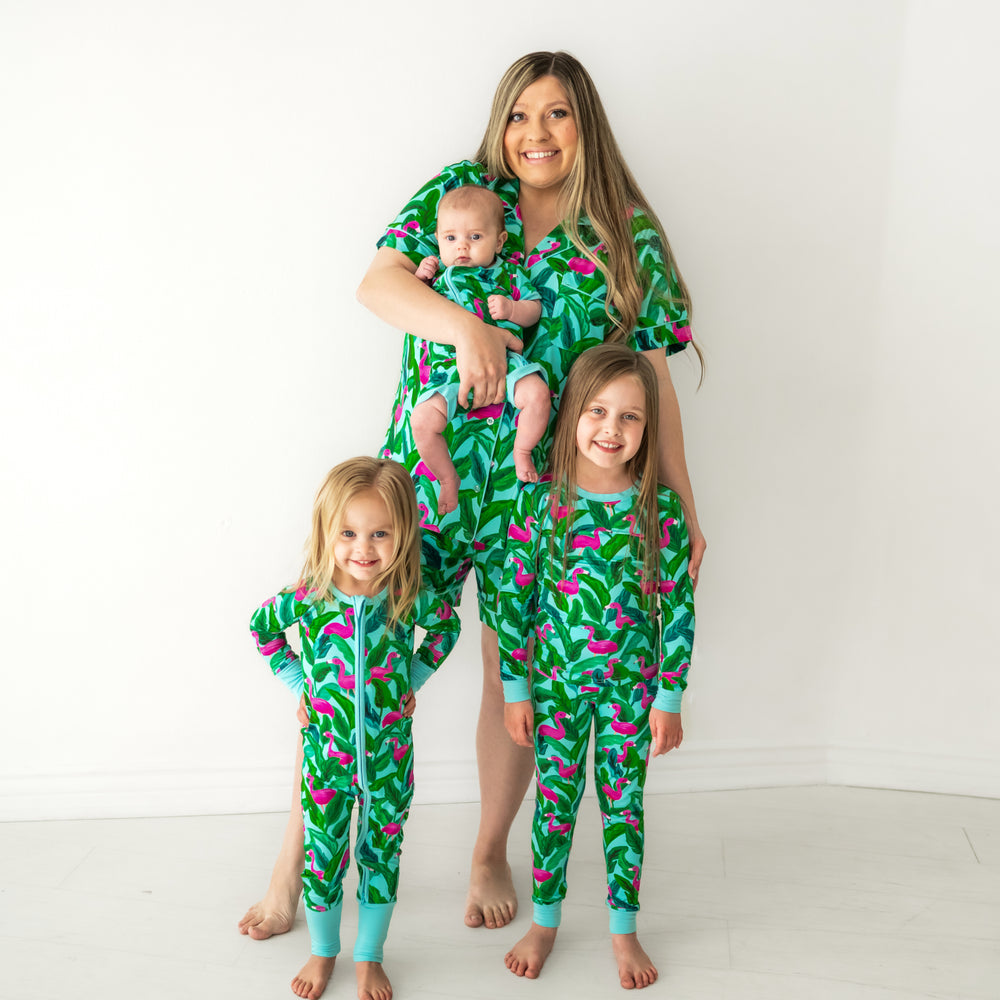 Mom and her three children wearing matching Palm Springs pajama sets. Mom is wearing Palm Springs women's shorts sleeve and shorts pajama sets and her children are wearing matching pjs in two piece and zippy styles