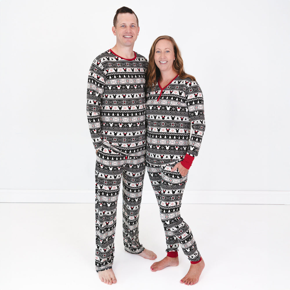 Man and woman wearing matching Mickey Fair Isle pjs in men and women's two piece styles