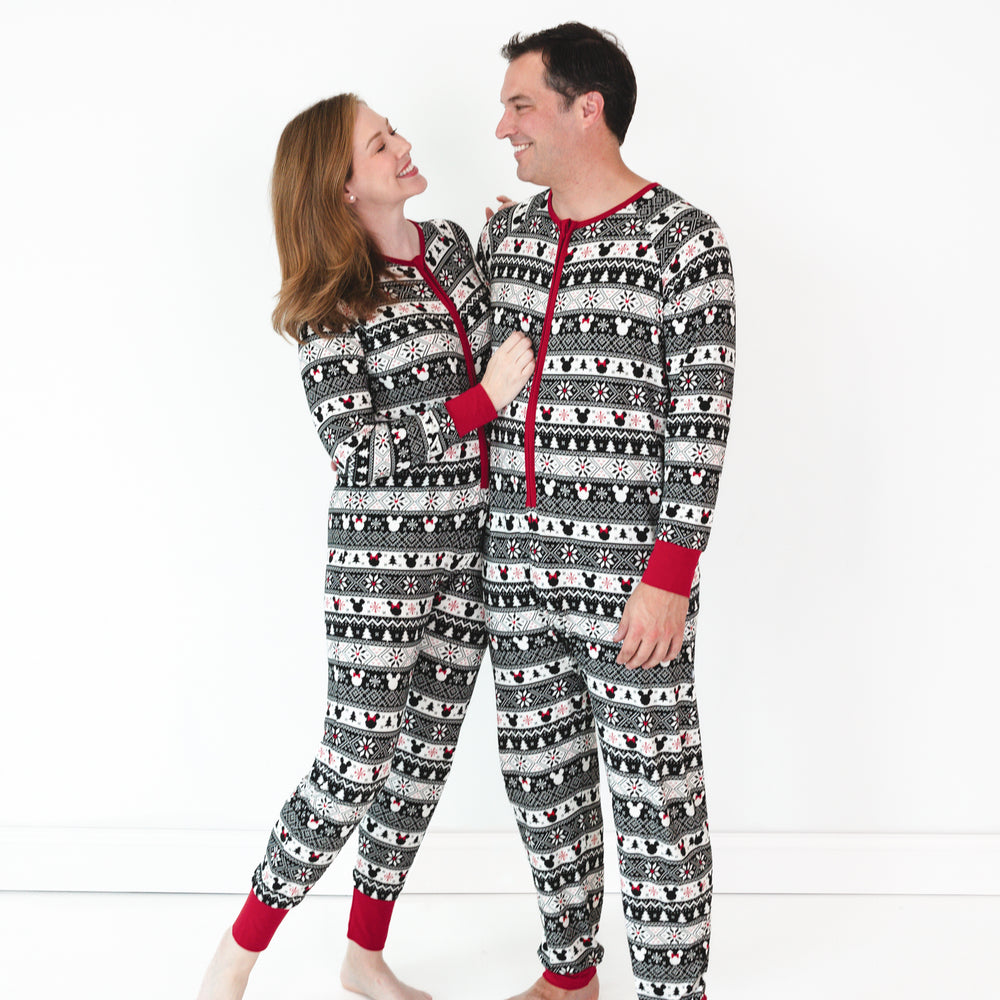 Man and woman wearing matching adult Mickey Fair Isle zippies