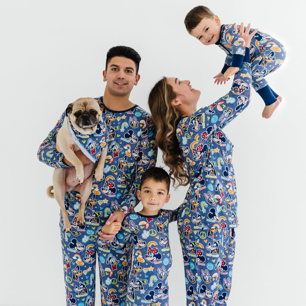 Close up of a family of four and a dog wearing matching Navy Disney Mickey's Clubhouse bamboo pajamas