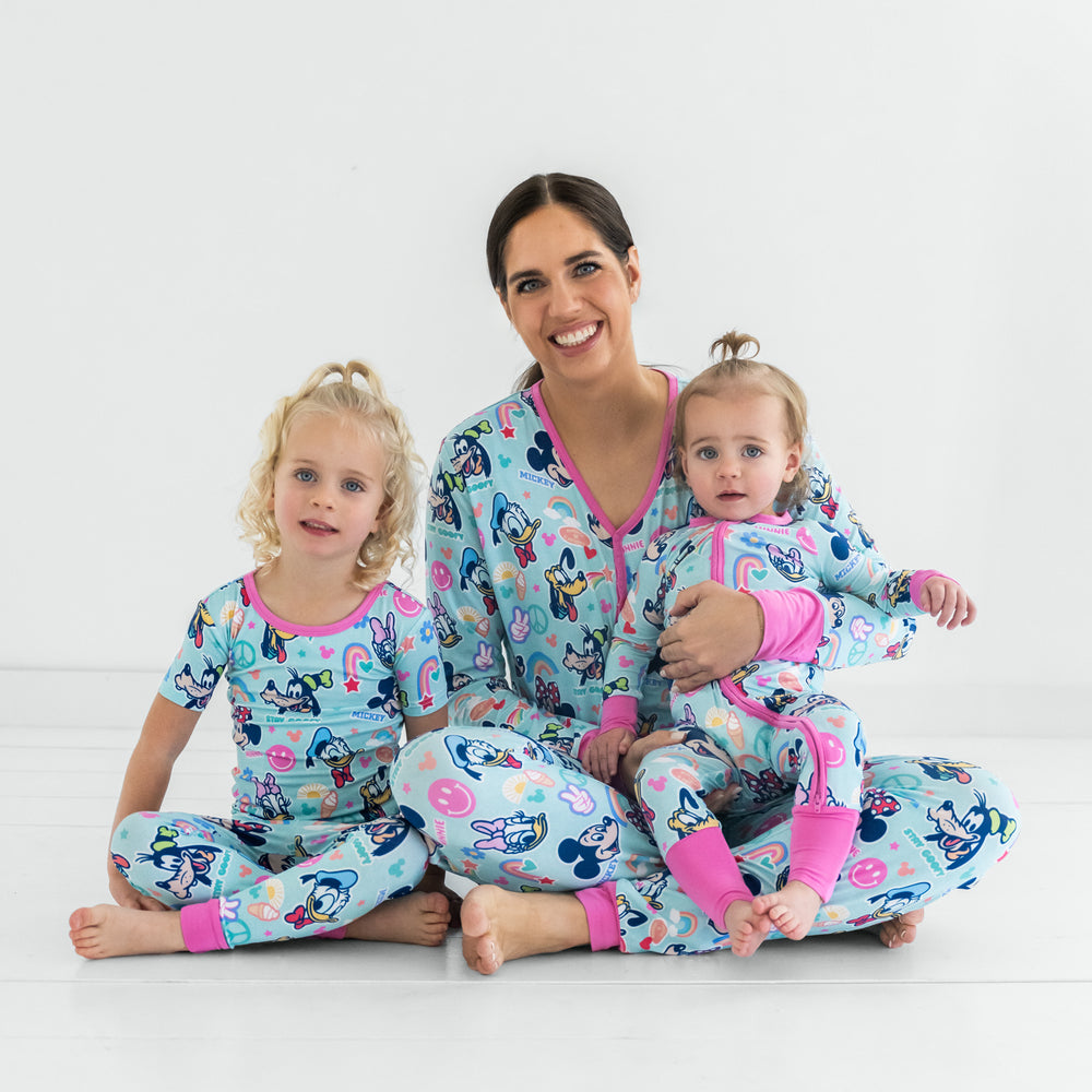 A mom and two children wearing matching Pink Disney Mickey's Clubhouse bamboo pajamas