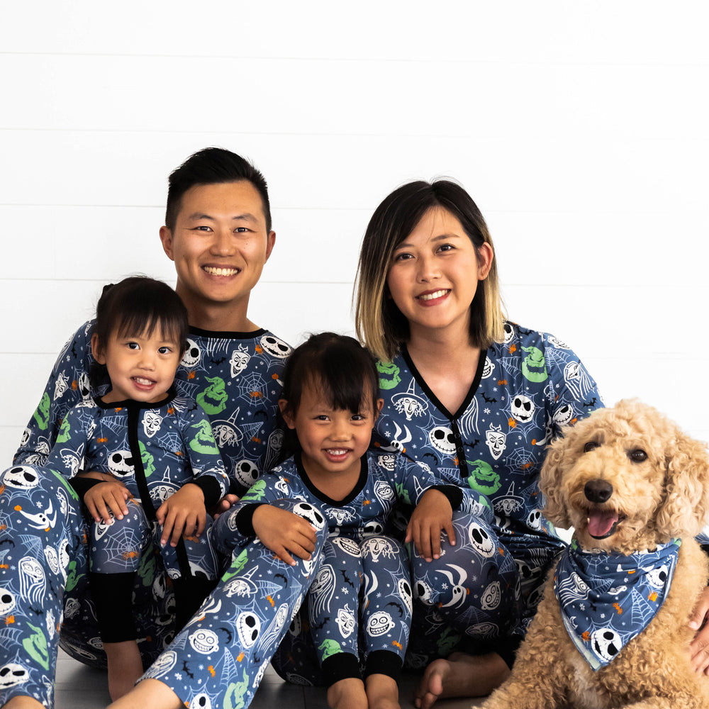 Family smilling while in the Disney Jack & Crew collection.Dog on the right is in the Disney Jack & Crew Pet Bandana