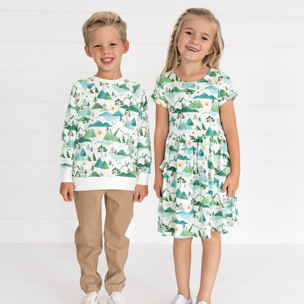 Image of two children wearing matching Mountain Mist outfits