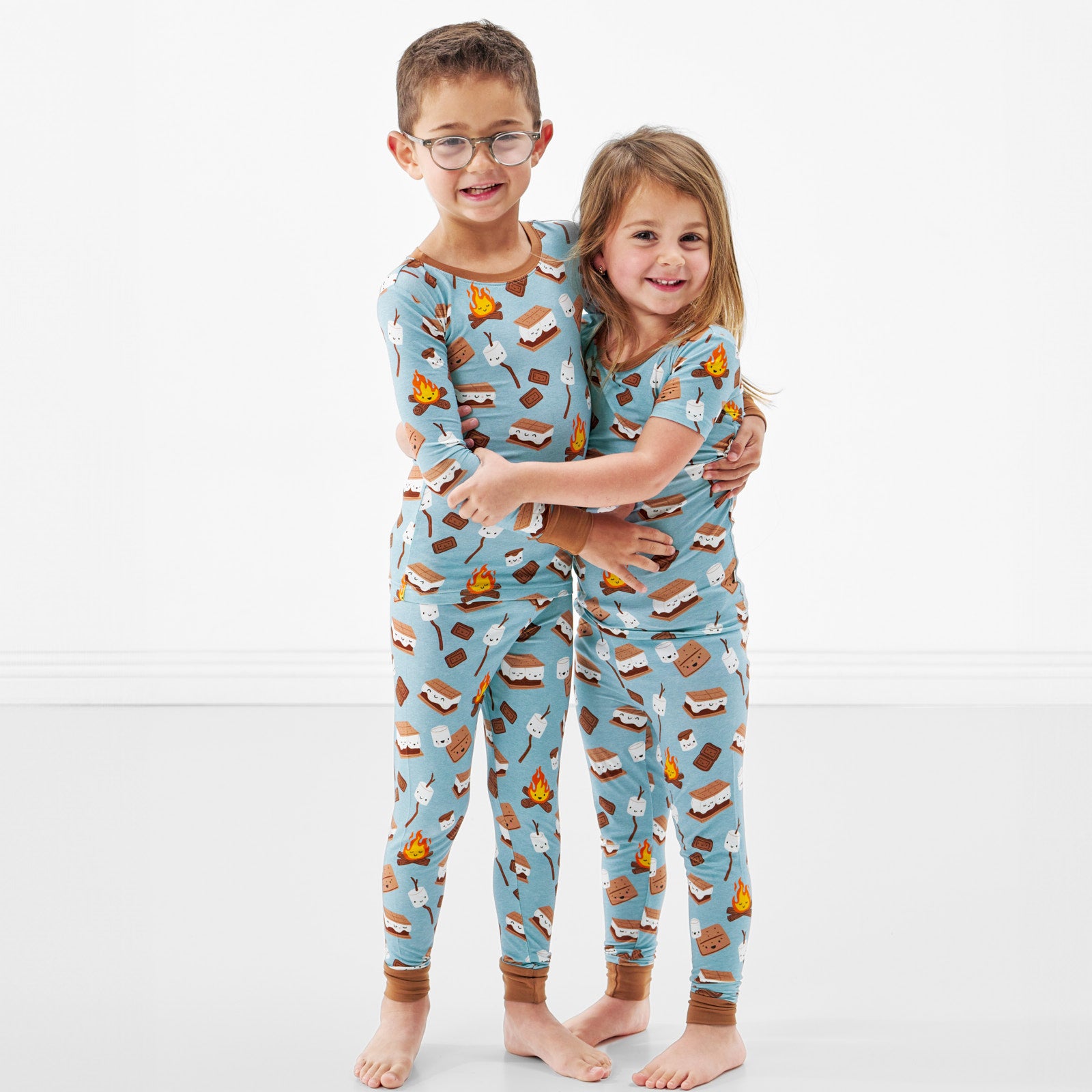 two children hugging wearing S'mores Galore two piece pj sets