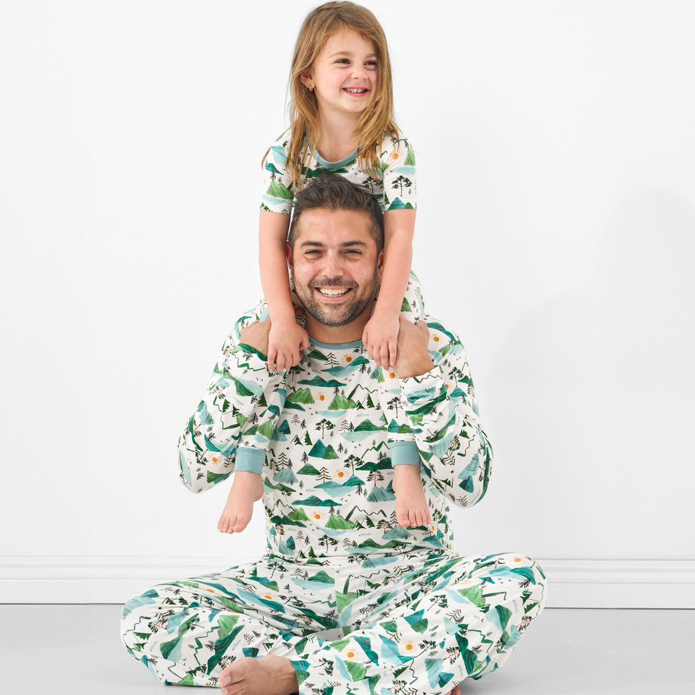 close up image of a father and daughter wearing matching Mountain Mist pjs