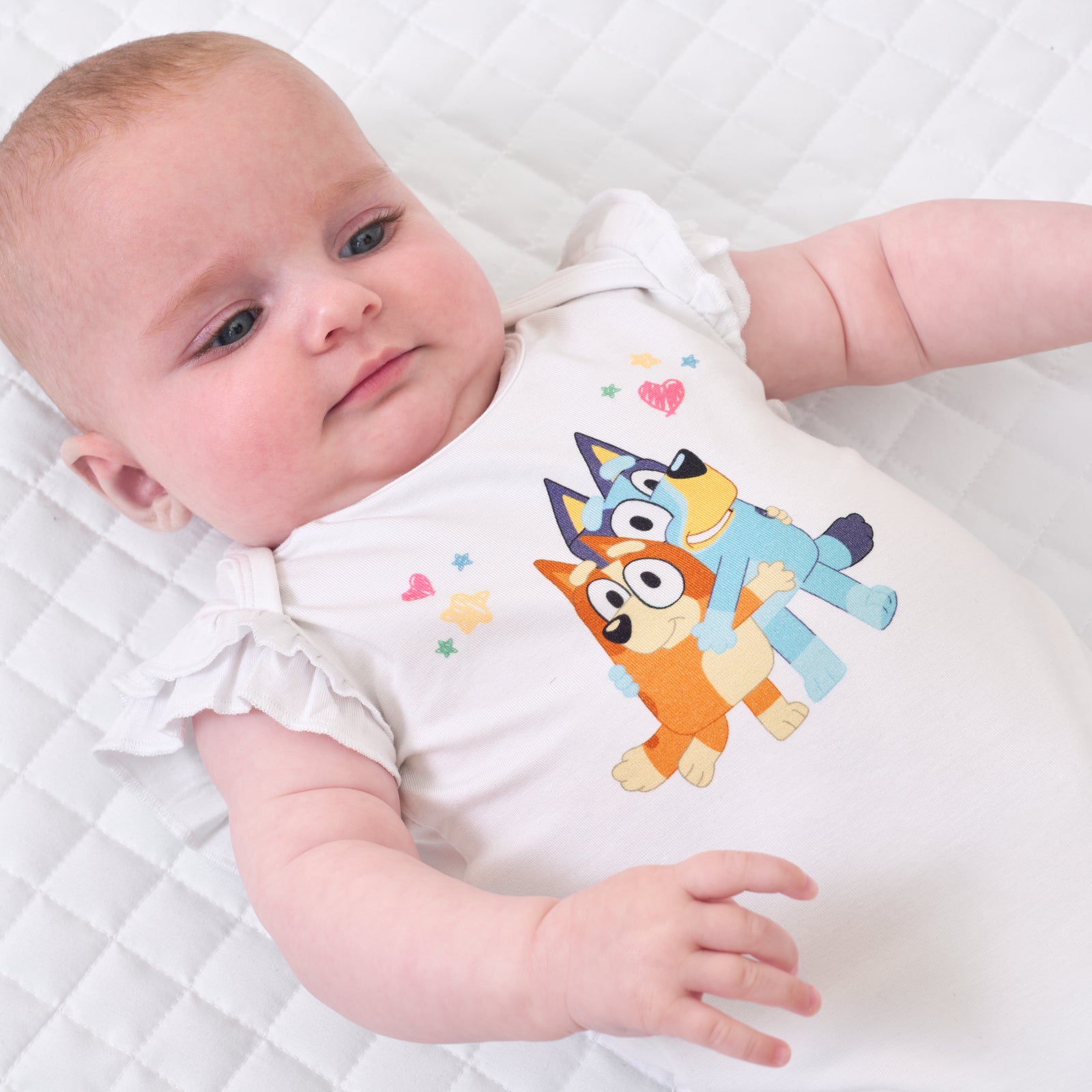 Close up image of a child wearing a Bluey graphic flutter bodysuit