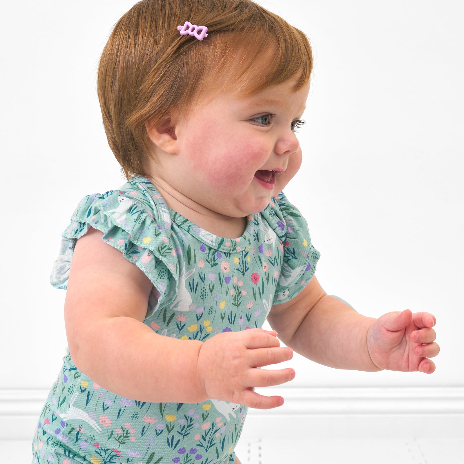 Close up image of a child wearing a Bunny Blossom flutter bodysuit