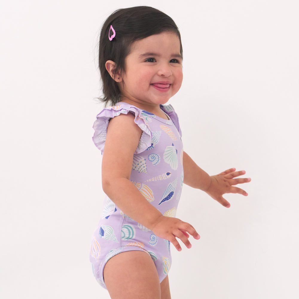 Alternate image of a child playing wearing a Sandy Treasures flutter bodysuit