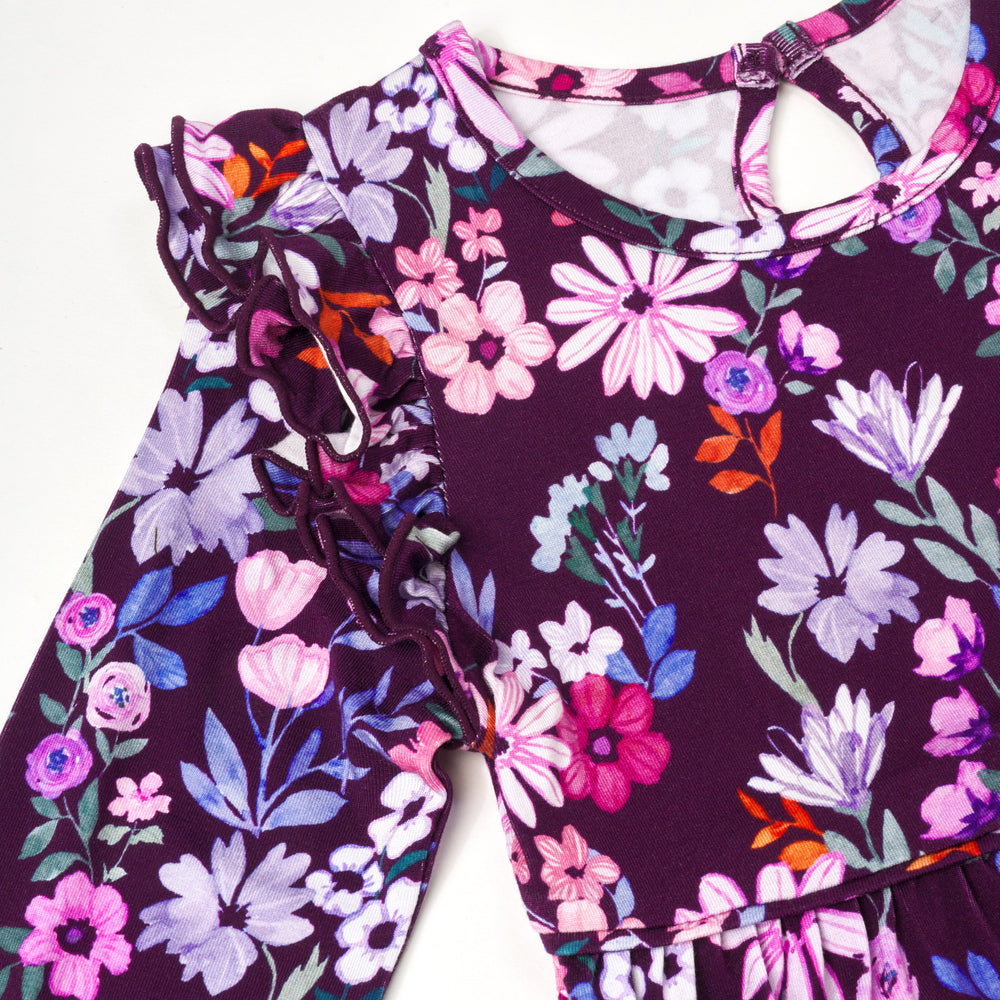 Close up flat lay image of Violet Meadow Bubble Romper