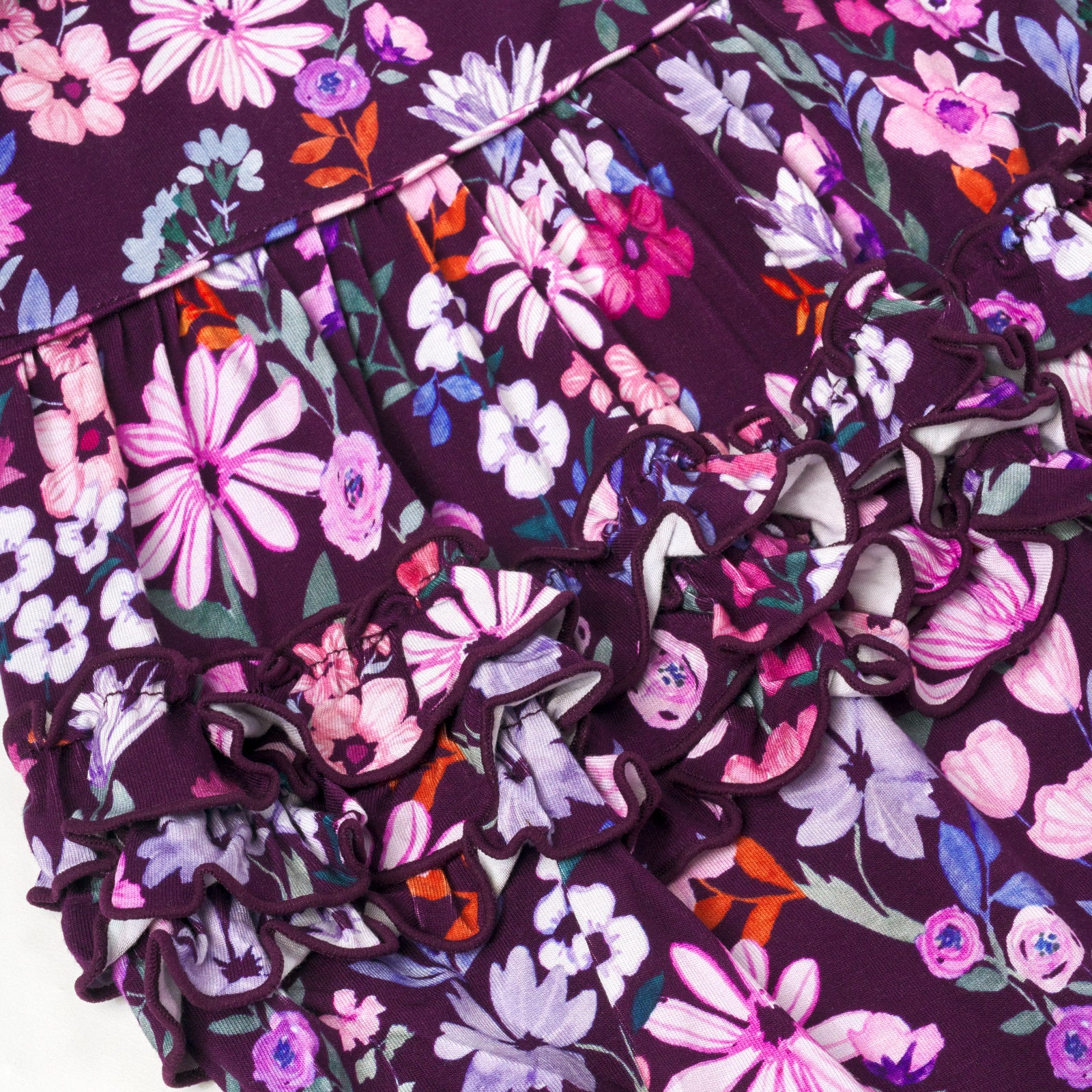 Close up flat lay image of Violet Meadow Bubble Romper detailing the ruffles