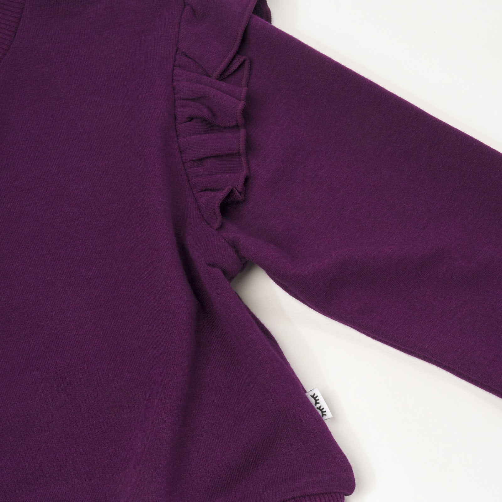 Close up flat lay image of Deep Plum Flutter Crewneck