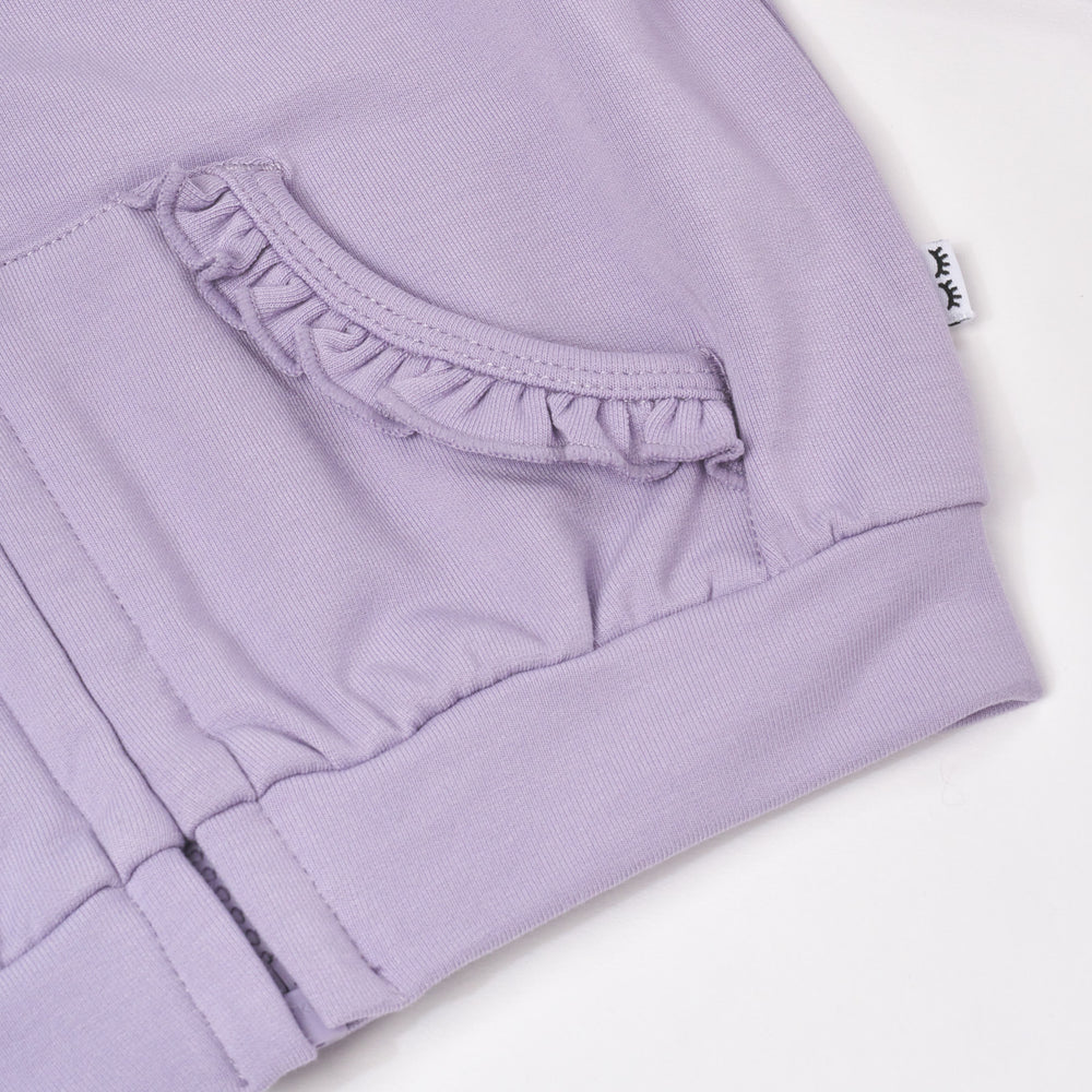 Close up flat lay image of Dusty Lavender Ruffle Hoodie detailing the front pocket