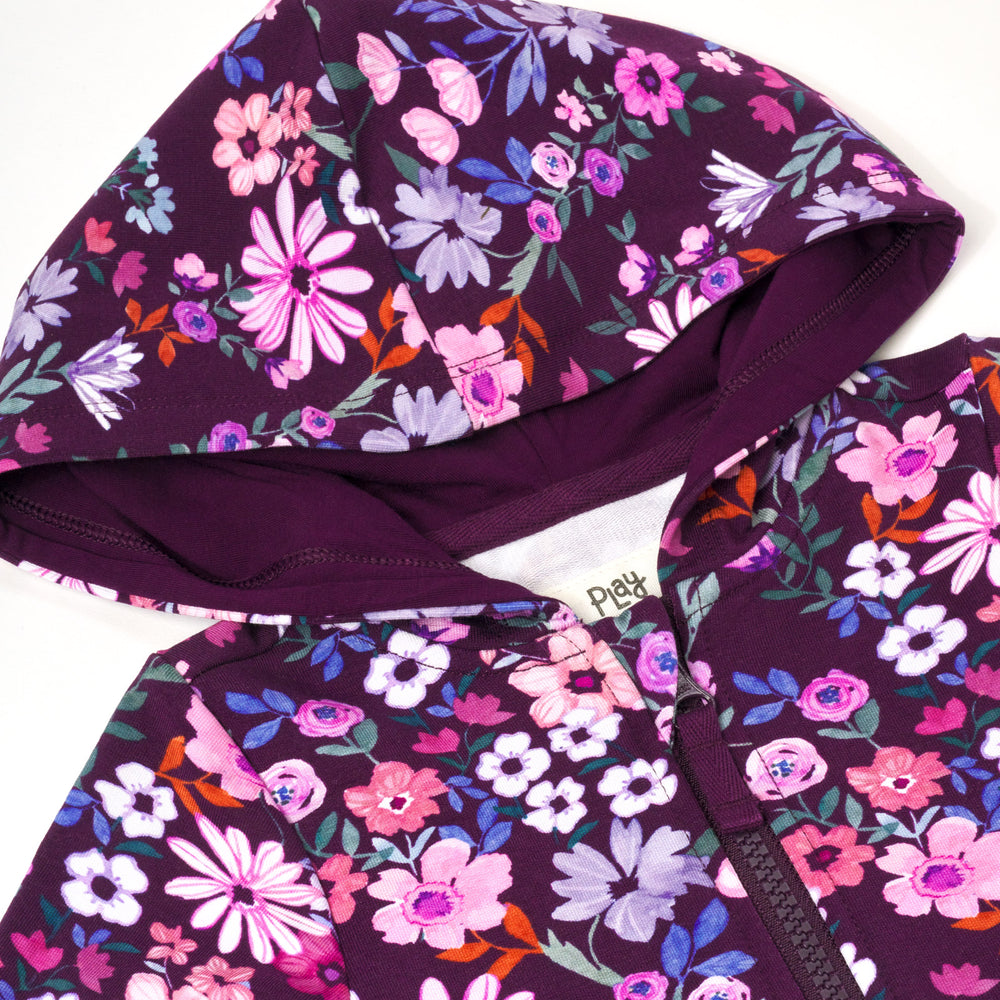 Close up flat lay image of Violet Meadow Peplum Hoodie