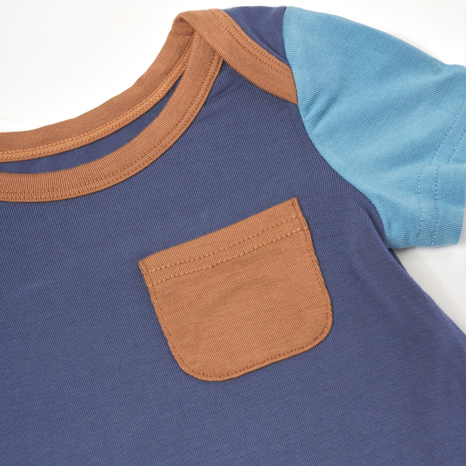 Close up flat lay image of Vintage Navy Colorblock Pocket Bodysuit