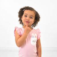 Alternate close up image of a child wearing a Pink Blossom flutter pocket tee