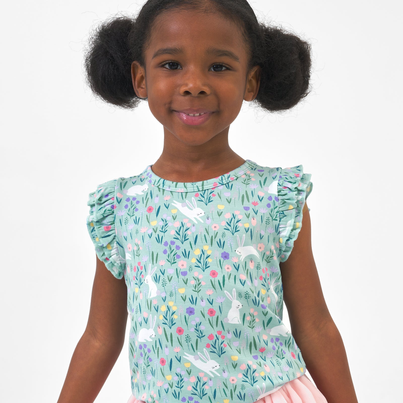 Close up image of a child wearing a Bunny Blossom flutter tee