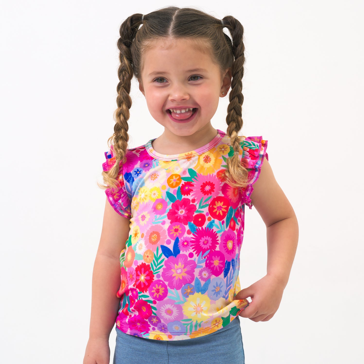 Child wearing a Rainbow Blooms flutter tee and coordinating shorts
