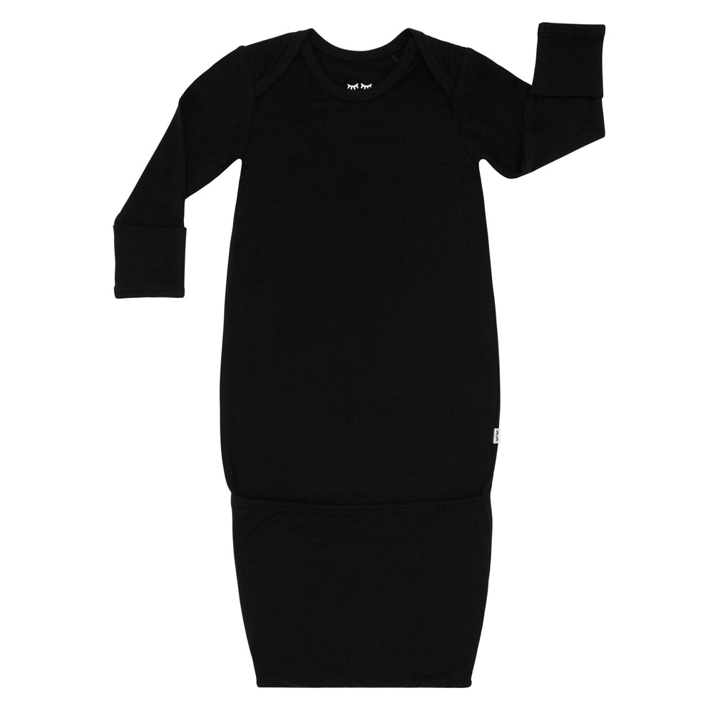 Flat lay image of a Black Infant Gown