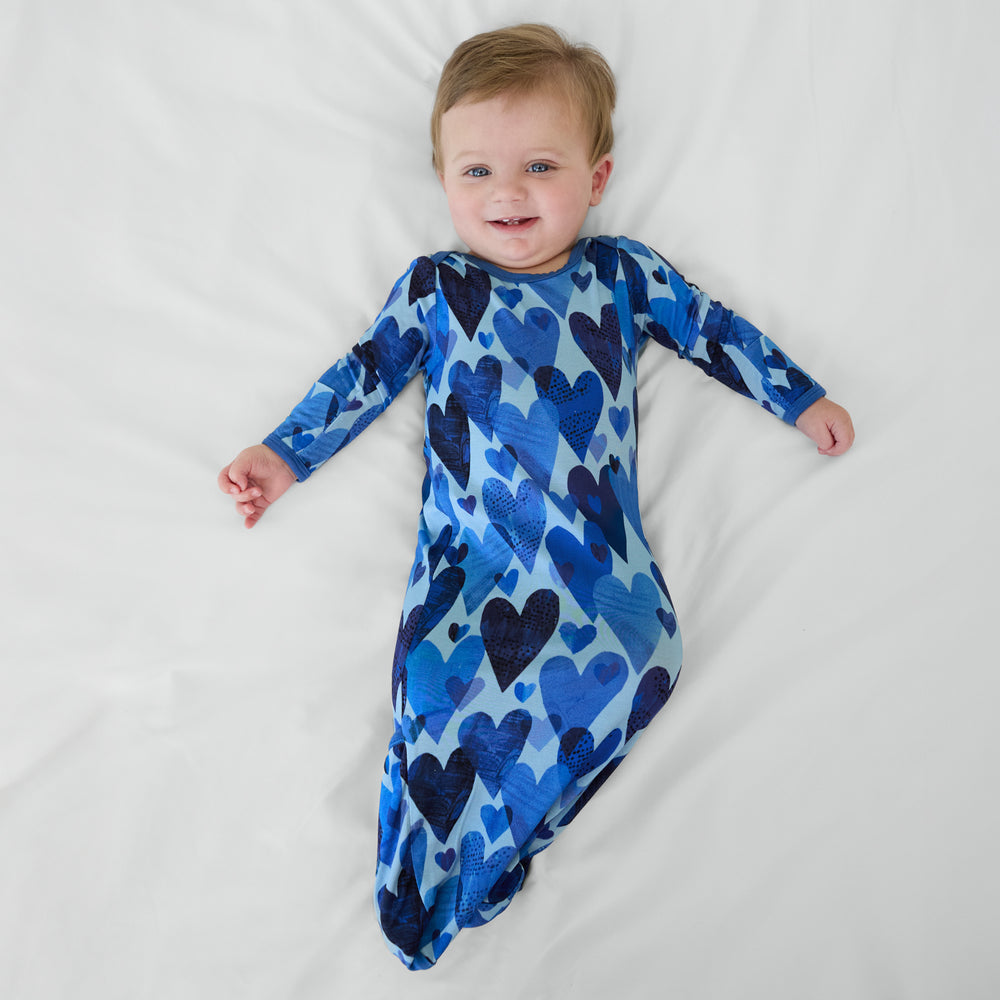 Child wearing Blue Hearts & Crafts infant gown.