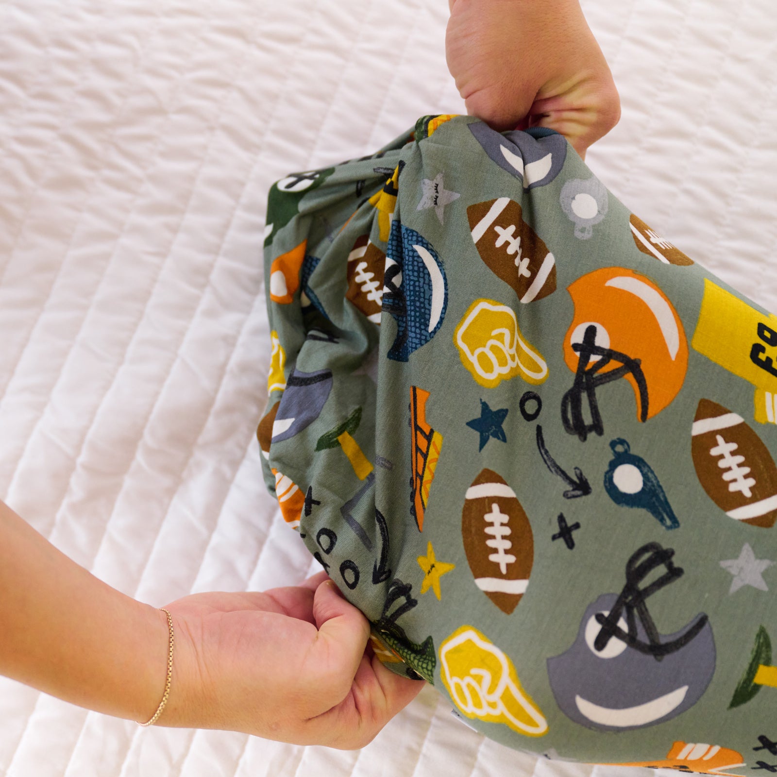 Alternative image of the bottom detail on the Touchdown Time Infant Gown